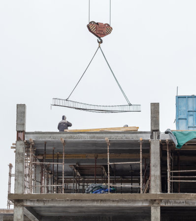 Construction of a multi-storey building with a tower crane.