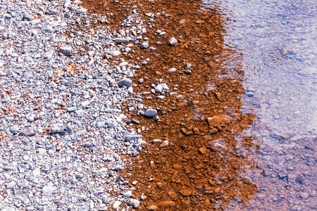 Stone pebbles on the shore as an abstract background. Textureの写真素材