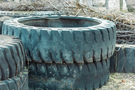 Old used tires in the fieldの写真素材