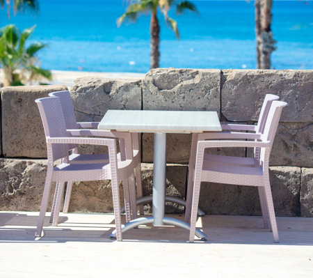 Plastic chairs and tables in an outdoor restaurant.の写真素材
