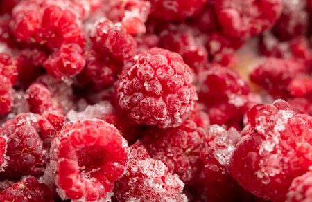 Frozen raspberries and blackberries close-up macro photography.