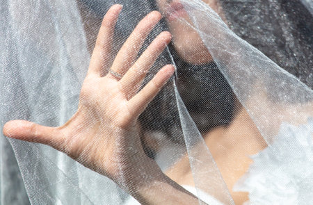 Wedding dress on the bride's hand, close-upの写真素材