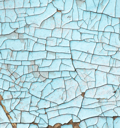Cracked blue paint on the surface of the old wall as a background.の写真素材
