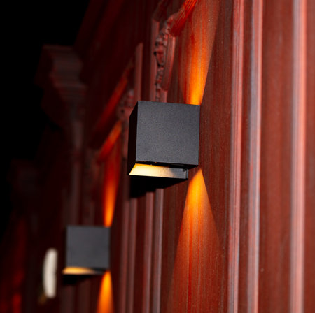 Lamps on the wall of a room with red walls and ceiling.の写真素材