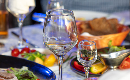 Close up of glasses of wine and snacks on the table.の写真素材