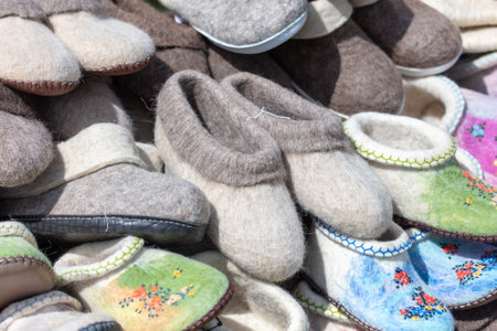 Handmade woolen slippers on sale at a flea market.の写真素材
