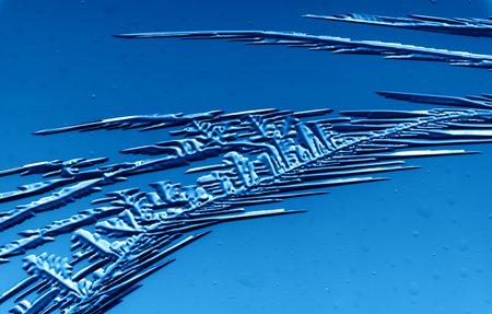 Drawings of ice on blue glass. Abstract backgroundの写真素材
