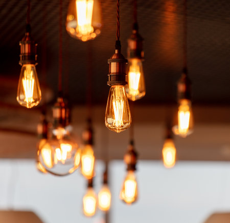 Decorative antique edison style filament light bulbs hanging from ceiling.の写真素材