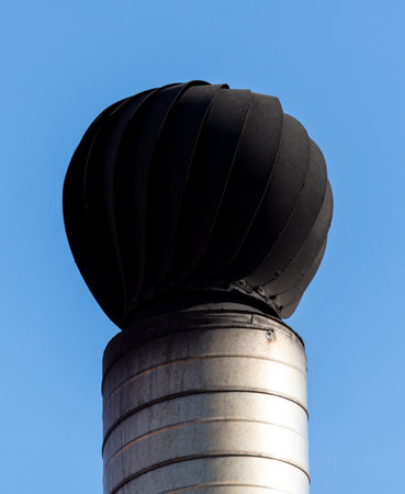 Chimney from the house for smoke against the blue sky.の写真素材