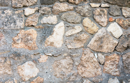 Old ancient bricks on the wall of the house as an abstract background. texture.の写真素材