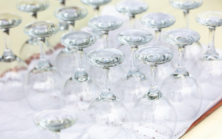 Clean glasses dry on a tray.