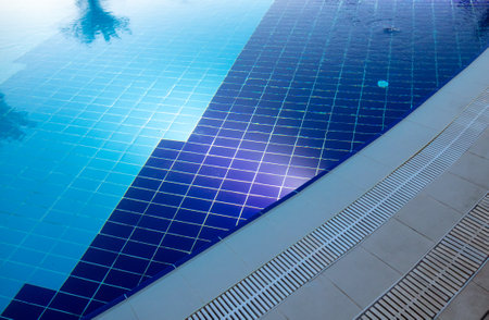 Blue water in the pool as a background at night.の写真素材