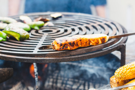 Meat on skewers is fried on the grill.の写真素材