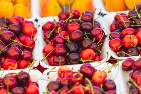 Fresh cherries on the counter in the market.