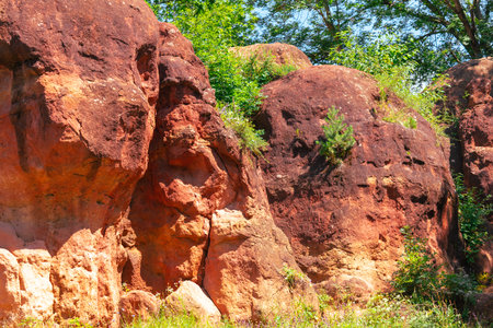Red rock as an abstract background. Texture.