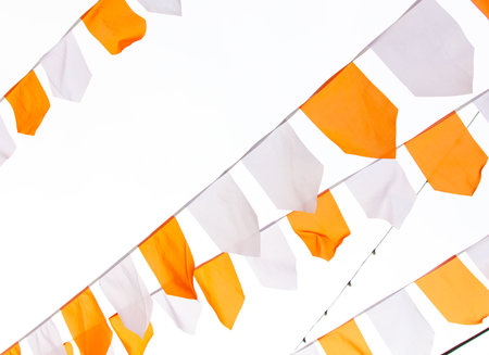 Orange and white festive flags isolated on white background.の写真素材
