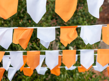 Festive white-orange flags as a background.の写真素材