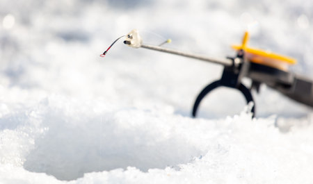 Fishing rod on ice in winter. Ice fishing.の写真素材