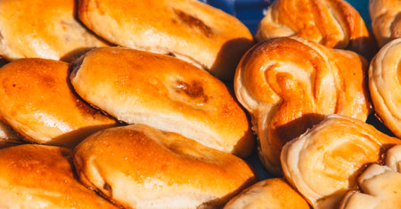 Baked dough buns as a background. Close-up.