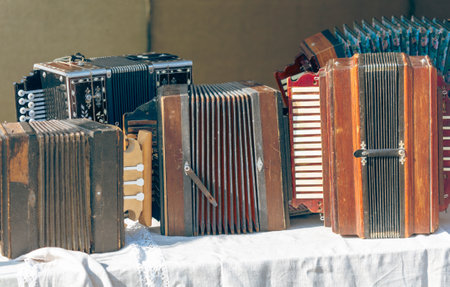 Old musical instruments accordion on the table.の写真素材