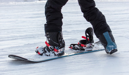 A man snowboards in the snow in winter.の写真素材