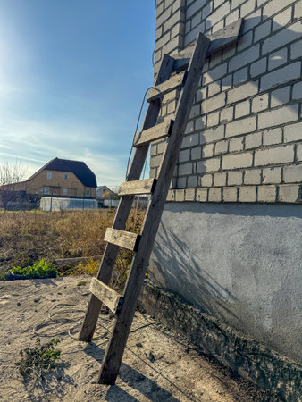 Wooden staircase against the wall of a brick house.の写真素材