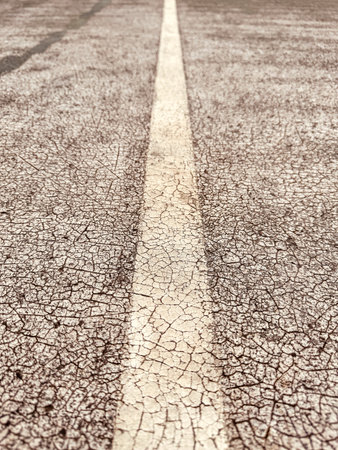 Old covering on a sports ground as an abstract background. Texture.の写真素材