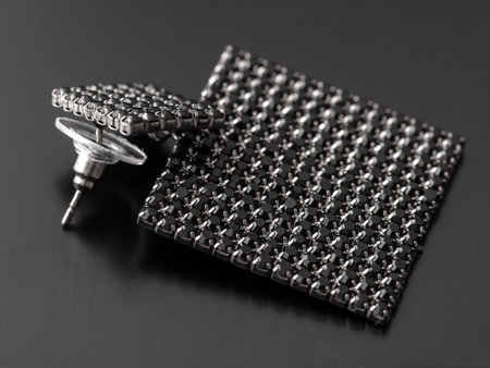 Precious stones on earrings isolated on black background.の写真素材