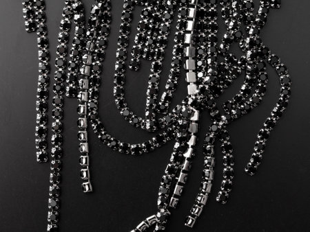 Precious stones on earrings isolated on black background.の写真素材