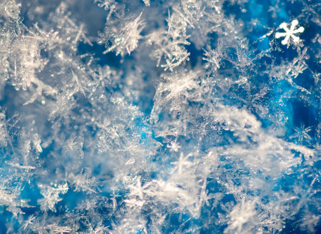 Close-up of snowflakes on a blue background. Macro.