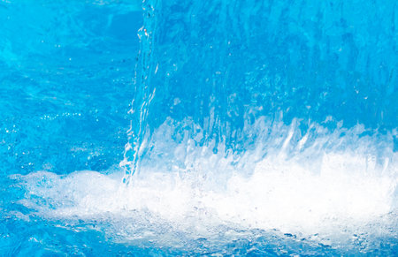 Splashes of water from a fountain as an abstract background.の写真素材