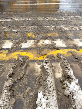 Pedestrian crossing on the road covered with snow.の写真素材