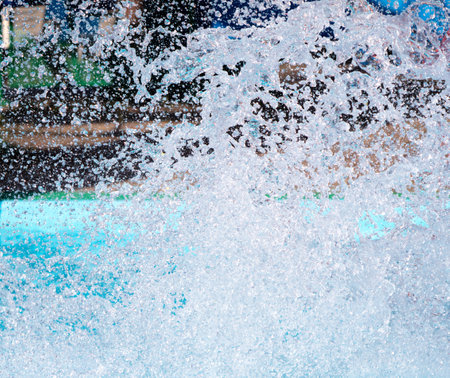 Splashes of water from a fountain as an abstract background.の写真素材