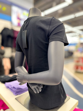 Men's T-shirt on a mannequin in the market.の写真素材
