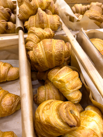 Croissants on a counter in a market.