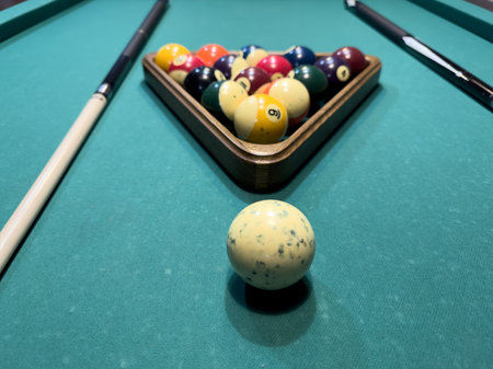 Close-up of balls on a billiard table.
