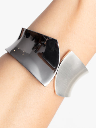 Close-up of a black bracelet on a girl's hand.の写真素材