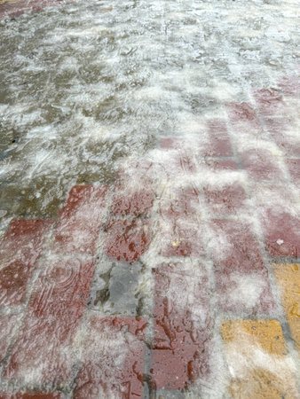 Paving slabs covered with snow. Background.