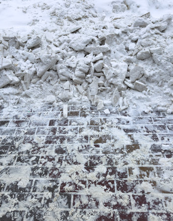 Snow on paving slabs in winter.