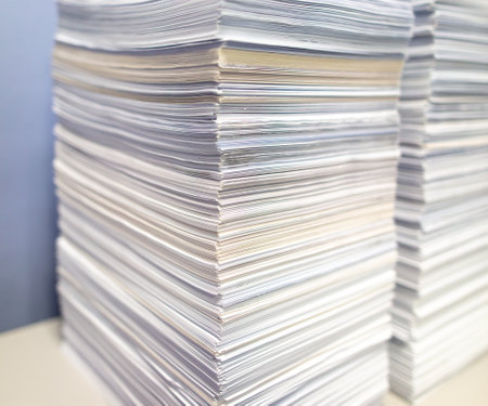 Stacks of papers on a table in the office.の写真素材