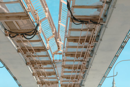 Detail of the steel structure of the bridge with blue sky.