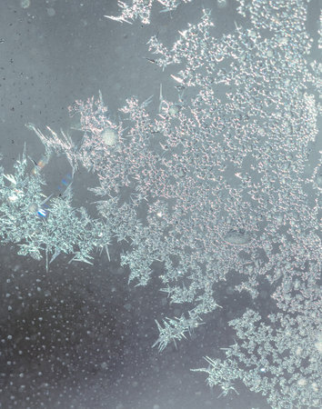 Frosty patterns on the window glass as a background.