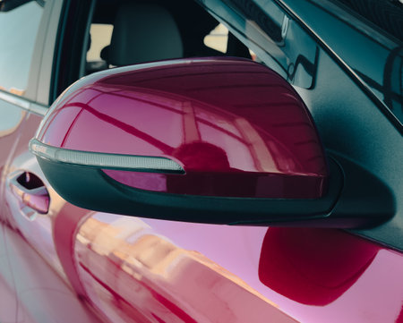 Mirror on a red car. Close-up.の写真素材