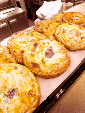 Ossetian pies on the counter in a cafe.