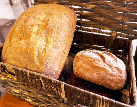 Fresh bread in a basket. Close-up.の写真素材