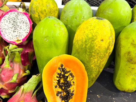 Fresh papaya on a counter in a market.の写真素材