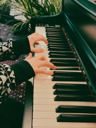Student's hands on the piano keys.の写真素材