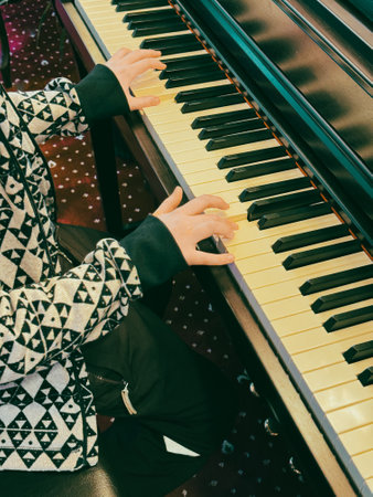 Student's hands on the piano keys.の写真素材