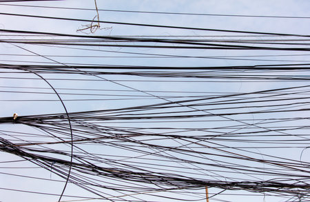 Electric wires against the sky as an abstract background.の写真素材