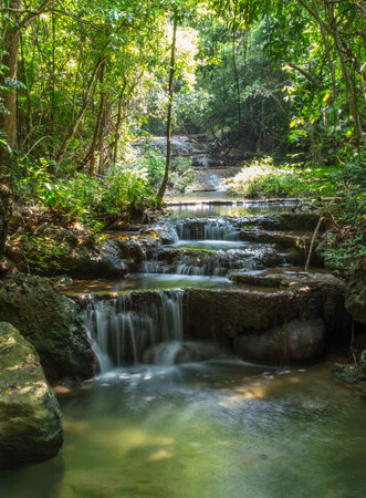Waterfall along a tropical river in Thailand.の写真素材